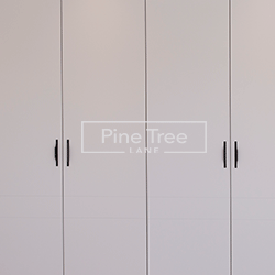 Sleek handles on a wardrobe