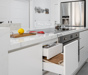 Modern kitchen countertop featuring integrated storage drawers