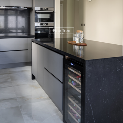 stylish kitchen boasts gray cabinets