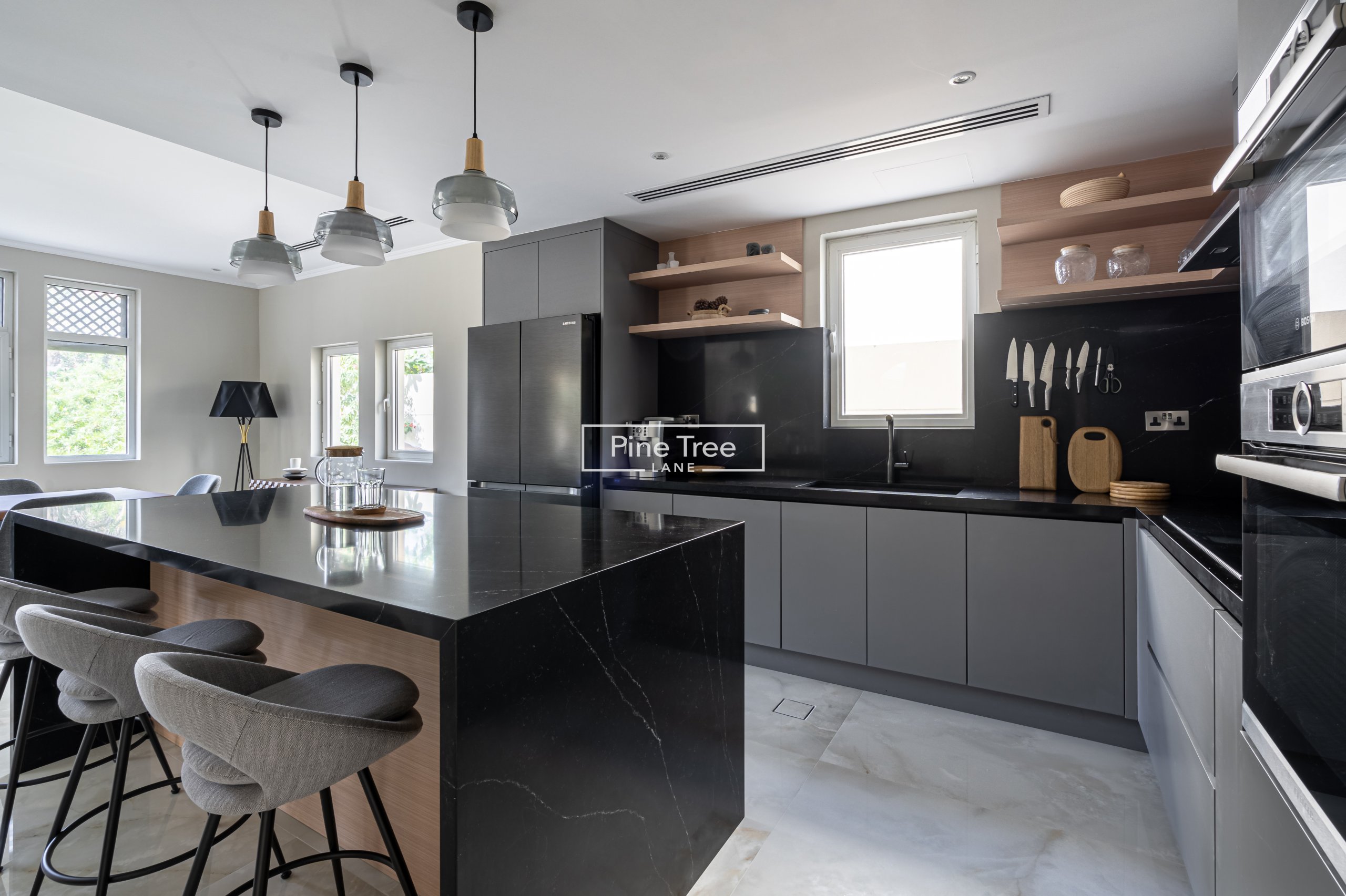 kitchen with black marble counter top and dining area
