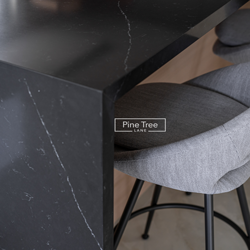 Close-up of kitchen bar chair and marble countertop