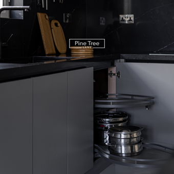 kitchen with warm-lit open shelves and functional corner storage