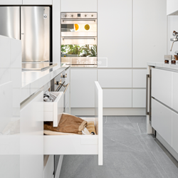 kitchen featuring smart storage drawers with wooden dividers