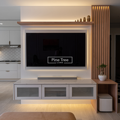 TV console with warm lighting and stylish wood accents