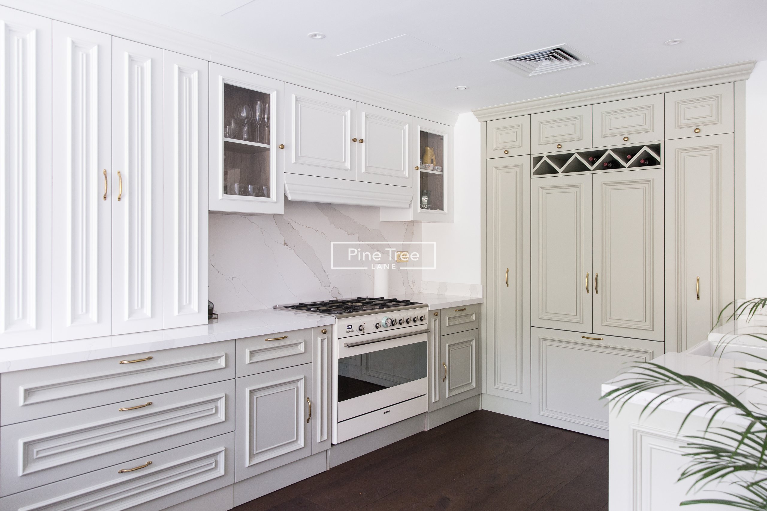 kitchen with sage and white cabinets