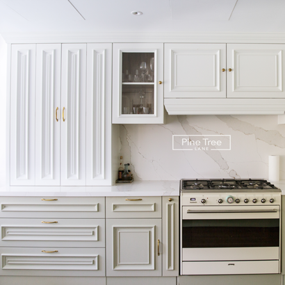 Kitchen with classic cabinets and gold handles
