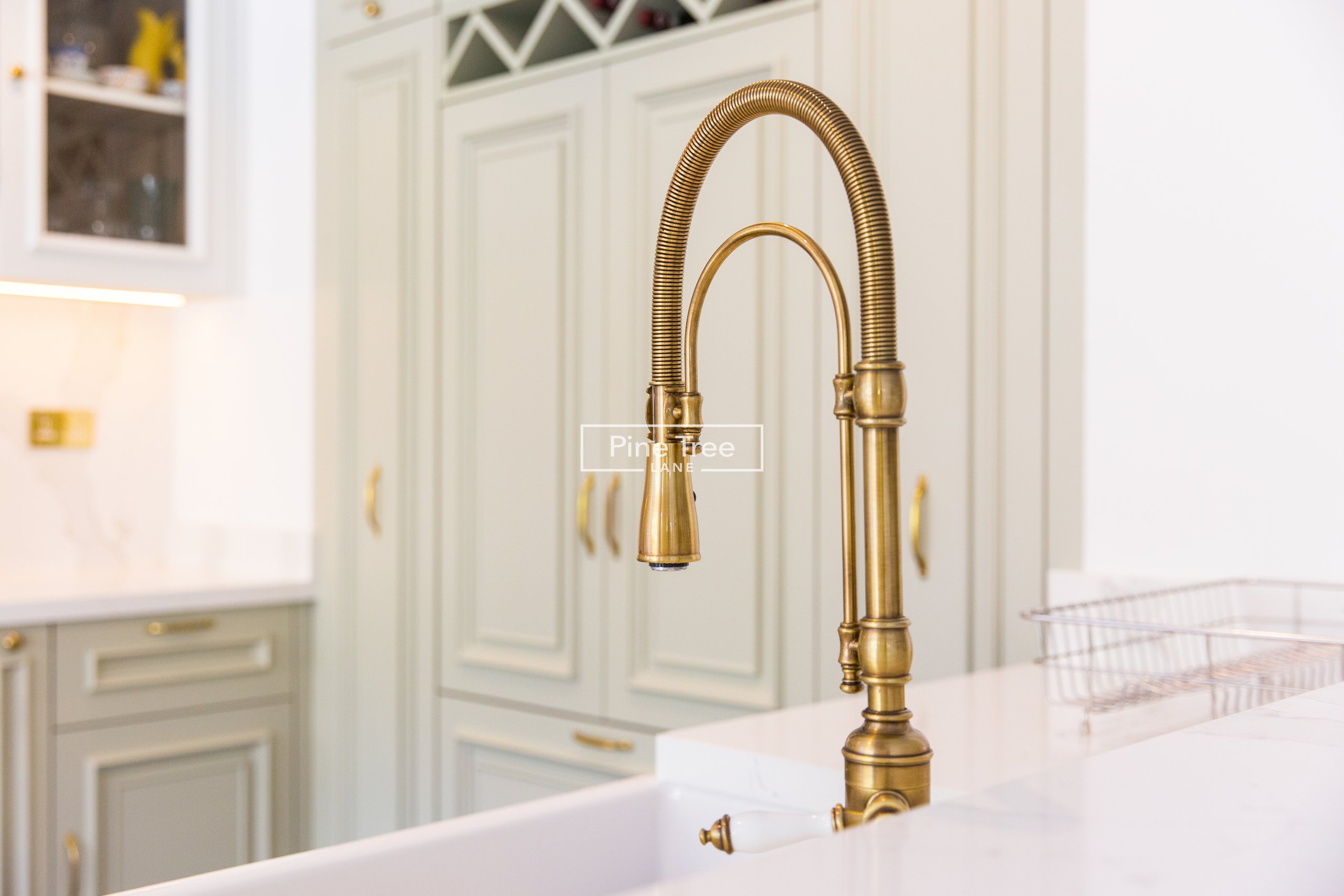 kitchen with brass sink fixtures