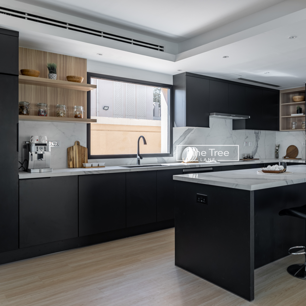 Kitchen with black cabinets and central island