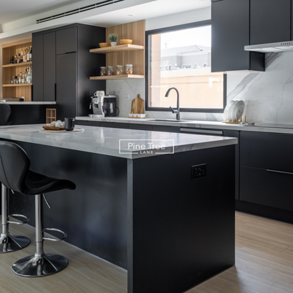 kitchen corner boasts a spacious island perfect for casual seating