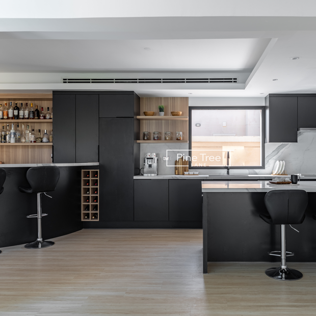 Modern black kitchen with bar and wood shelving