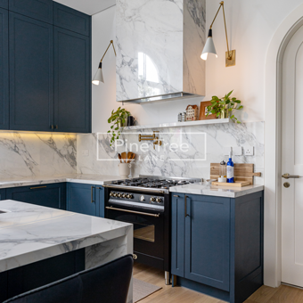 Modern kitchen featuring navy blue cabinetry