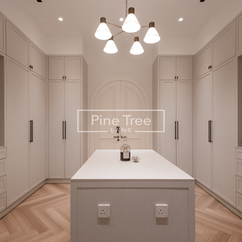 Custom wardrobe with full-height cabinetry and chevron flooring