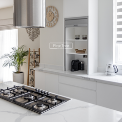 Kitchen with white joinery and marble countertops