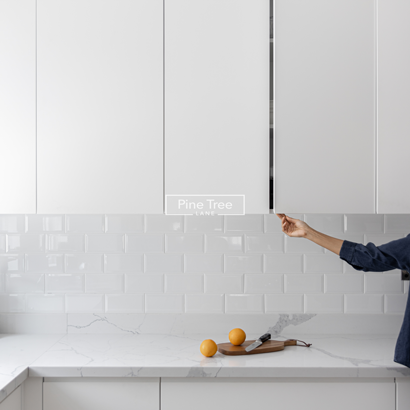 Kitchen showcases white cabinetry