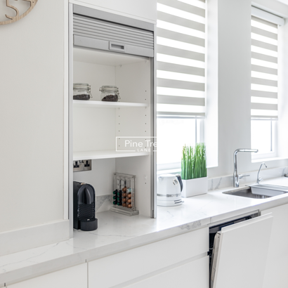 kitchen with organized drawers and subway tiles