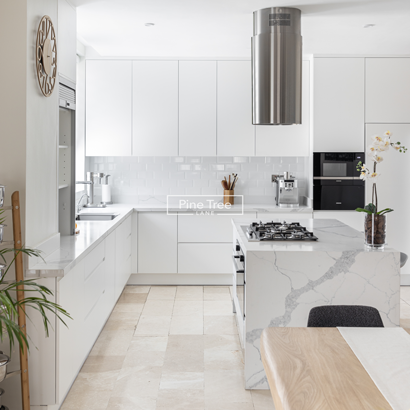 Kitchen with white joinery and marble countertops