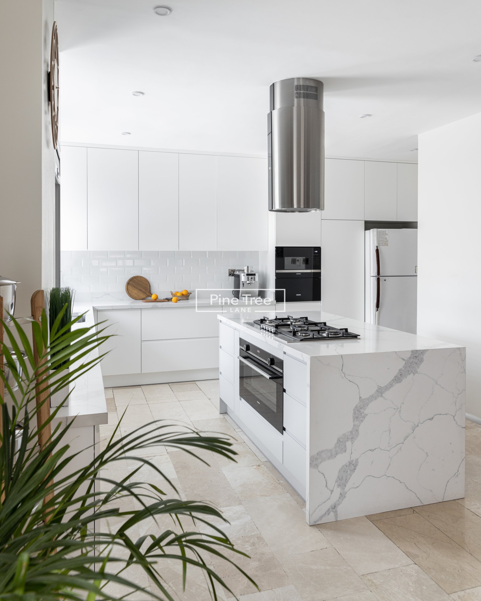 kitchen with white cabinets and stone countertops