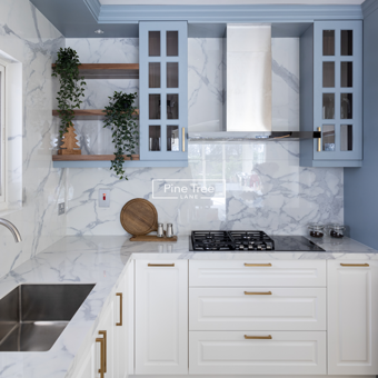 kitchen with modern blue upper and white lower cabinetry