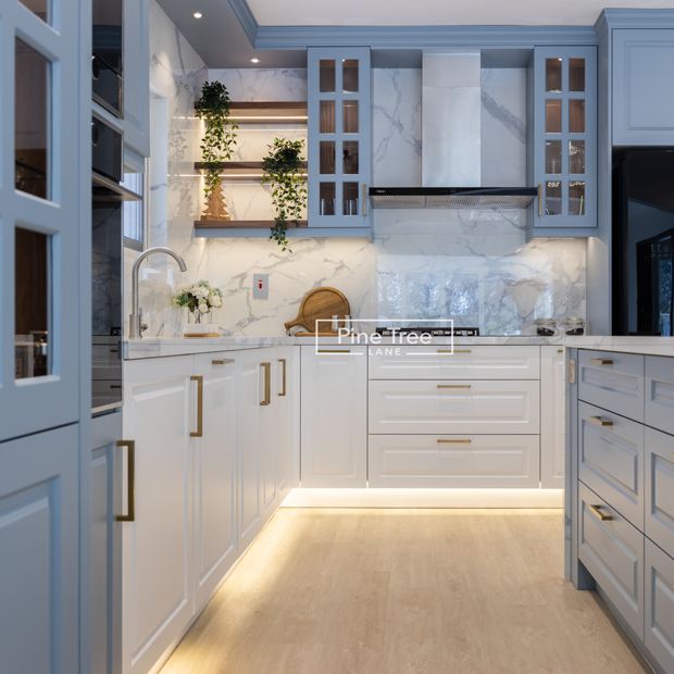kitchen with marble countertops and gold-toned accents