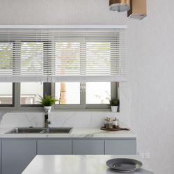 kitchen space with marble counters and warm brass lighting