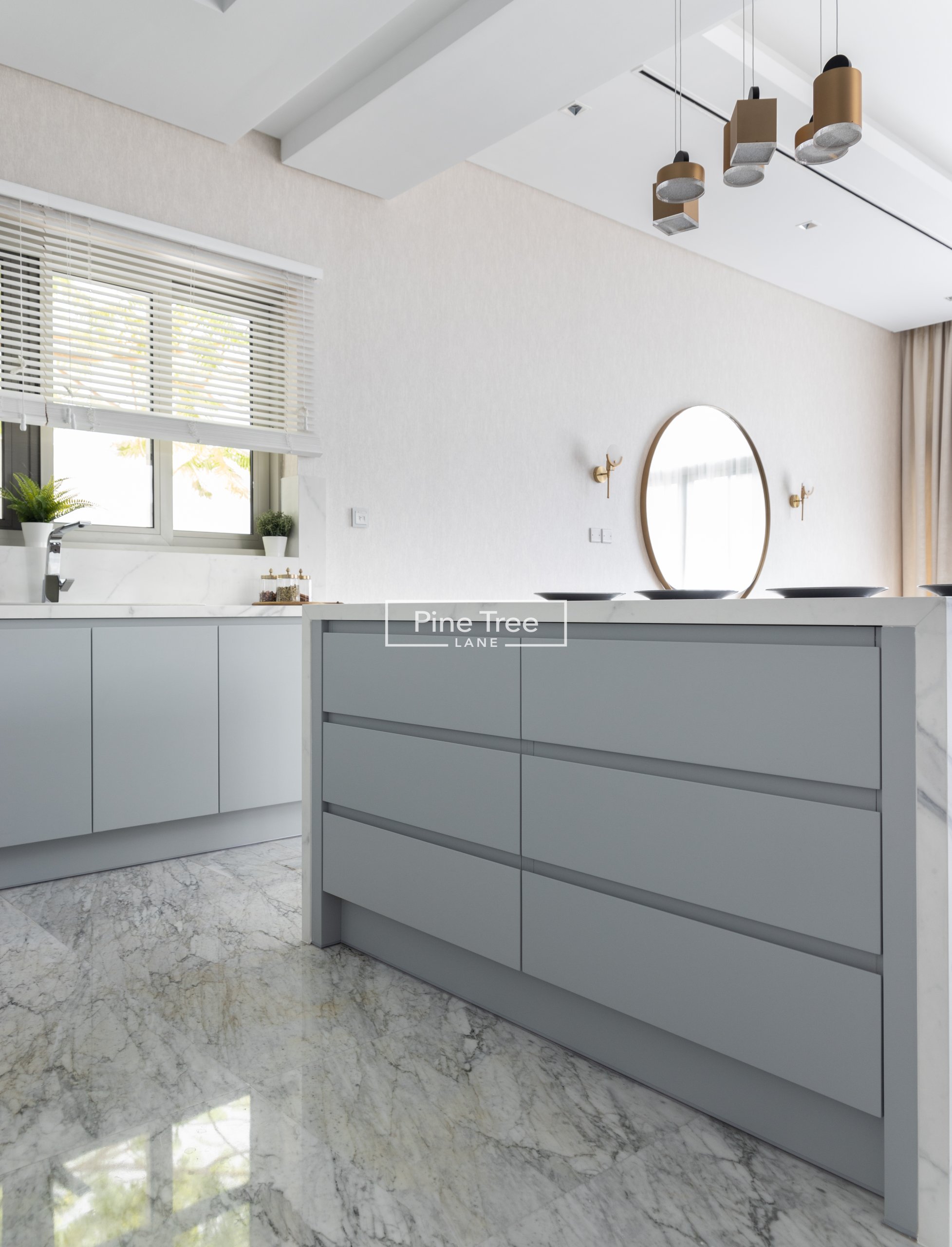 Kitchen sleek grey cabinets with gold pendant lights
