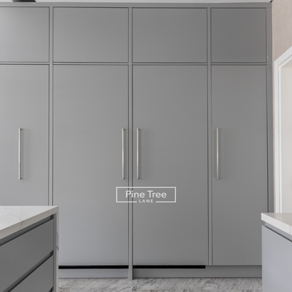 Floor-to-ceiling cabinetry with integrated handles