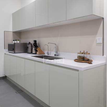 pantry kitchen features glossy handle less cabinetry and a seamless white countertop