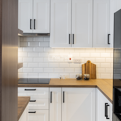 Kitchen white cabinet and storage tower