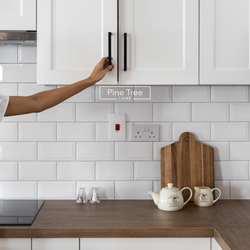 kitchen with white cabinetry and wood textures