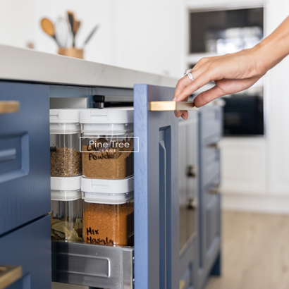 Organized spice pull-out featuring labeled storage containers