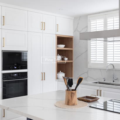 Sleek white kitchen interior with modern appliances