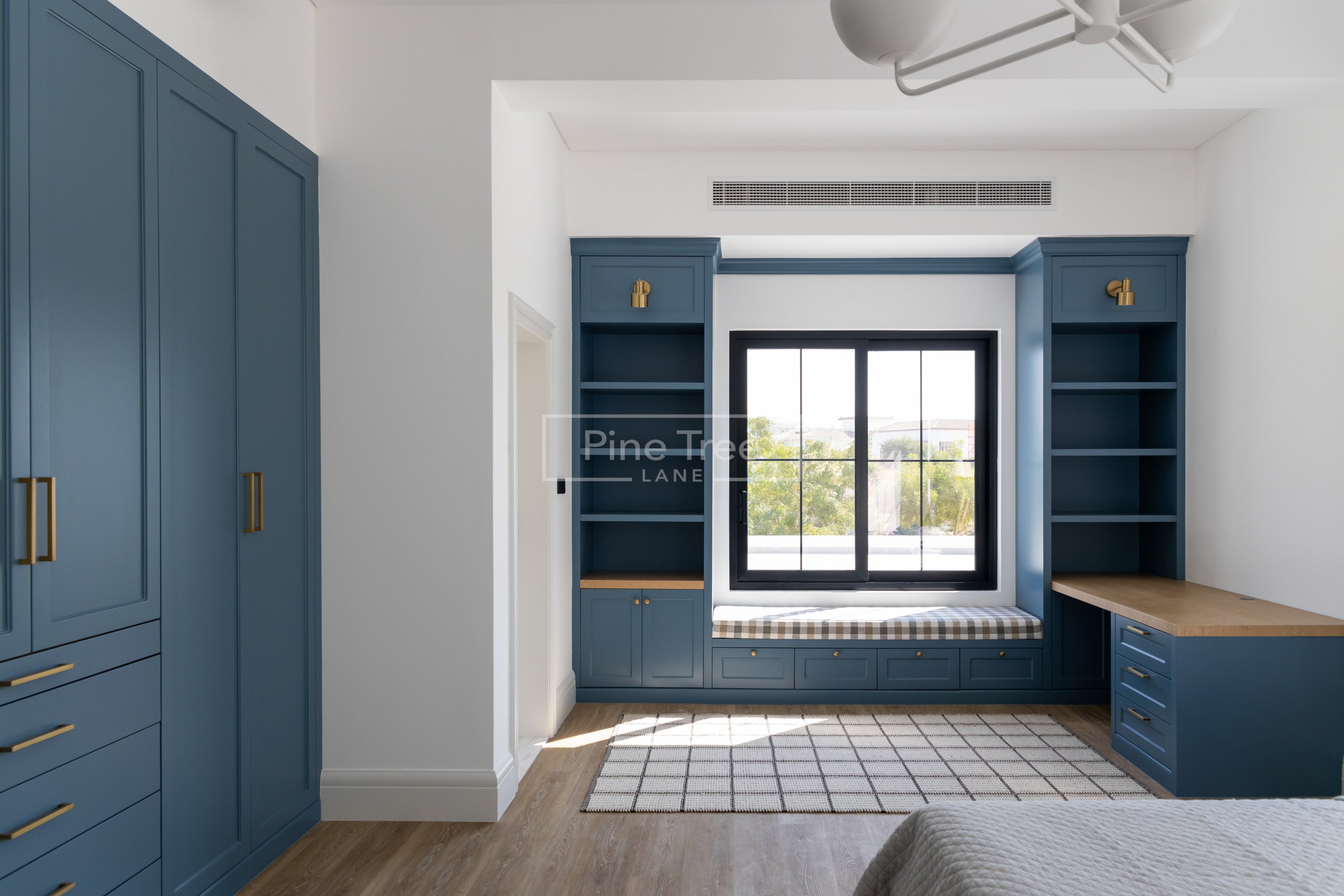 bedroom nook with built-in bench and storage