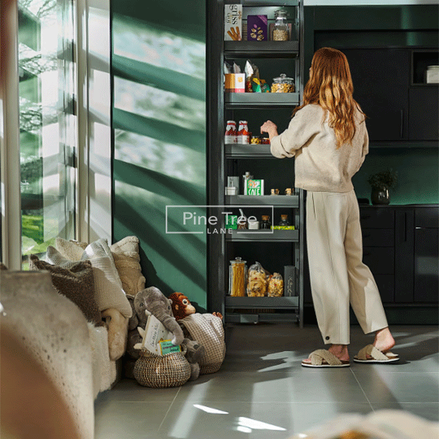 Woman organizing kitchen storage with accessories