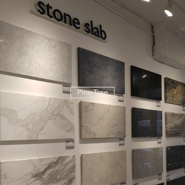 Marble and stone samples displayed on slabs