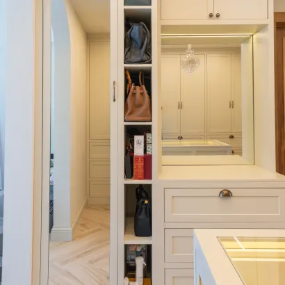 Custom pull-out vertical shoe rack and white fitted wardrobe shelves