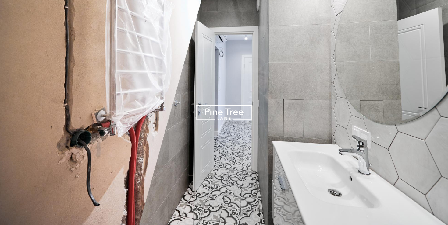 Bathroom renovation in Dubai with modern vanity, patterned floor tiles, and contemporary fixtures